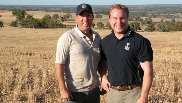 Rob the farmer from Western Australia and I standing in wheat stubble.